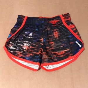 NWOT Reebok Speedwick athletic dolphin hem shorts. Multicolored. Size XS.